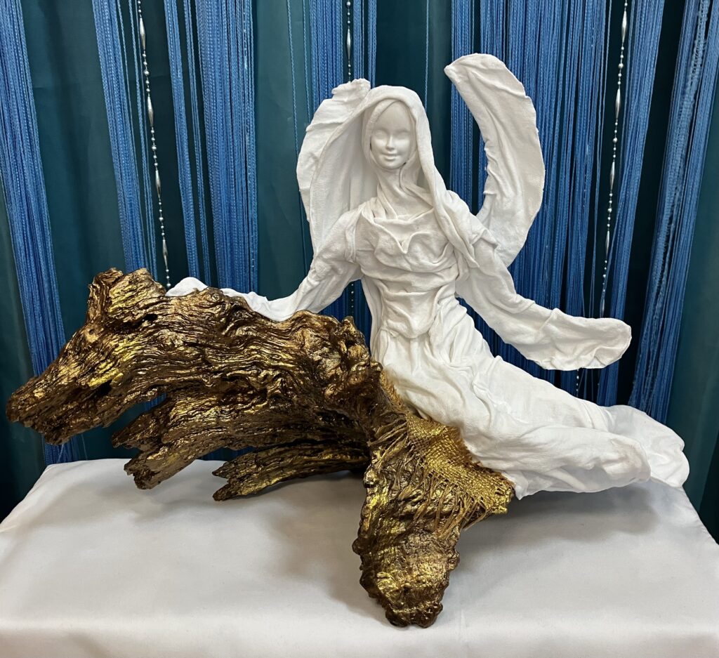 Anjel sediaci na zlatej poduške-samorast